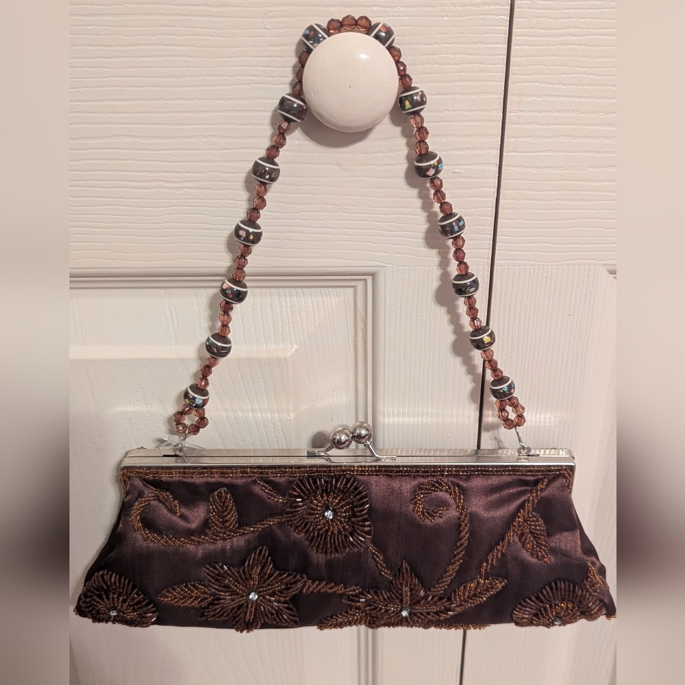 Sasha New York beaded brown clutch with removable straps.